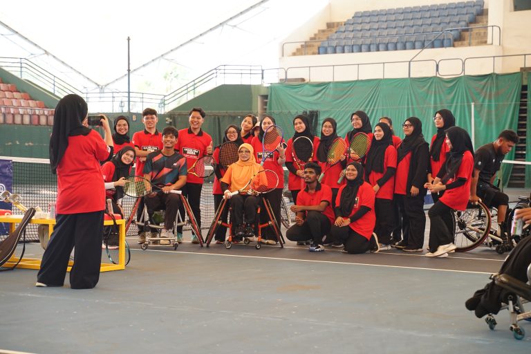 YSS volunteers with wheelchair tennis players at MIFA Breaking Barriers 2.0